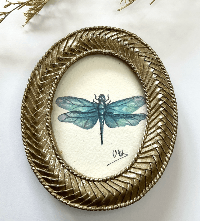 Libellule bleue dans son cadre miniature doré
